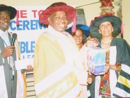 graduating_don_bishop_samson_kitheka_from_uk_centre_president_world_federation_of_churches_presenting_gifts_to_pastor_shirley_rose_from_tanzania_r_pastor_joseph_kiyimba_with_microphone_interpreting_20160429_2087239478